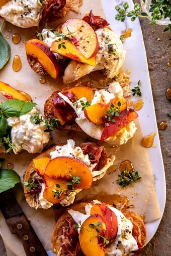 Peach Burrata Parmesan Crostini with Hot Honey | halfbakedharvest.com