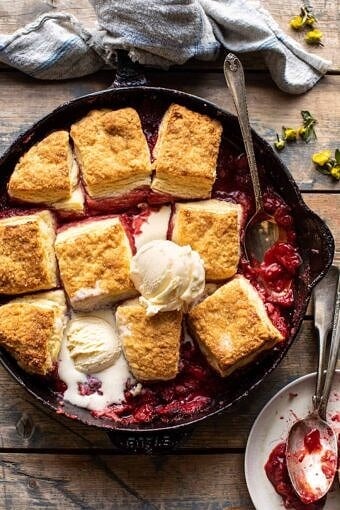 Skillet Strawberry Bourbon Cobbler with Layered Cream Cheese Biscuits | halfbakedharvest.com