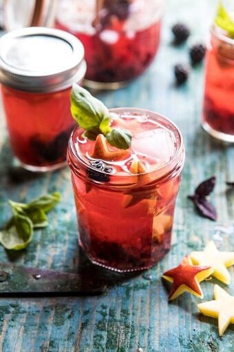 Smashed Berry Rose Spritz | halfbakedharvest.com #cocktails #4thofjulyrecipe #summerrecipes #easy